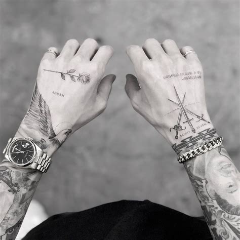 tattoo in hand for men|guy hand tats.